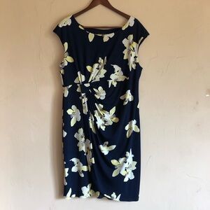 Faux wrap style.  Gathering makes dress very flattering for any body type.